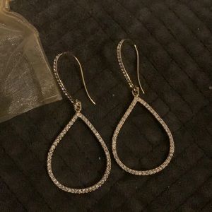 These are a beautiful pair of earrings. They are gold with rhinestones.